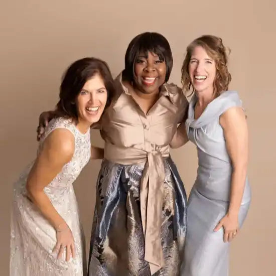 3 women wearing mother of the bride dresses