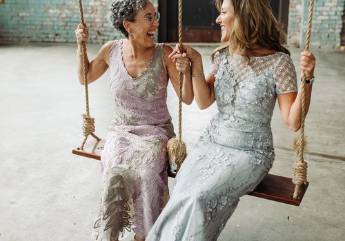 mother of the bride and groom on a swing